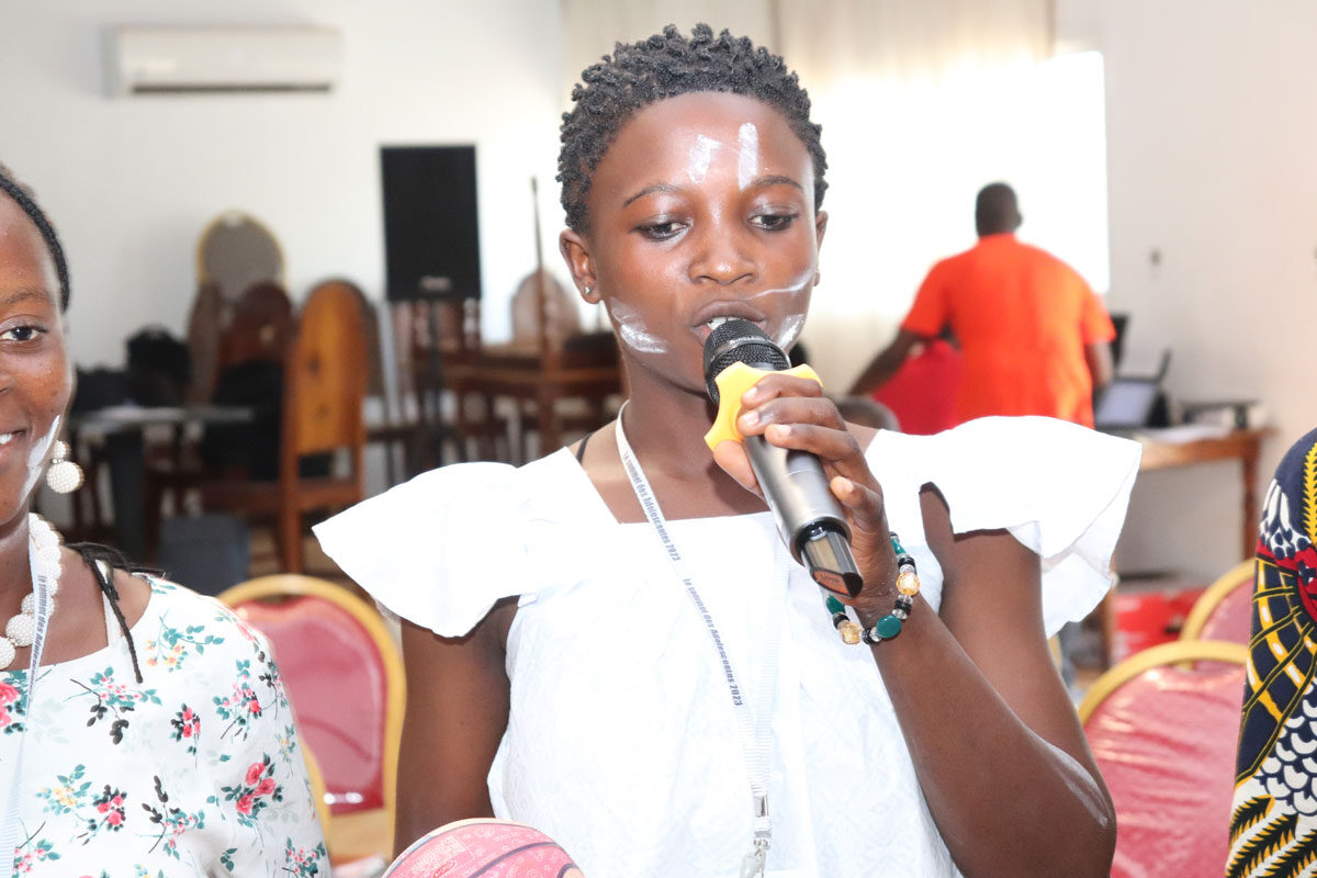 A young person speaking at the Adolescent Girls Summit for French-speaking youth